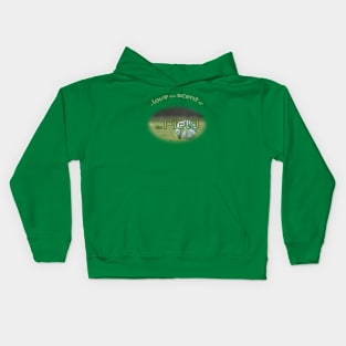 Green soccer ball in the field Kids Hoodie